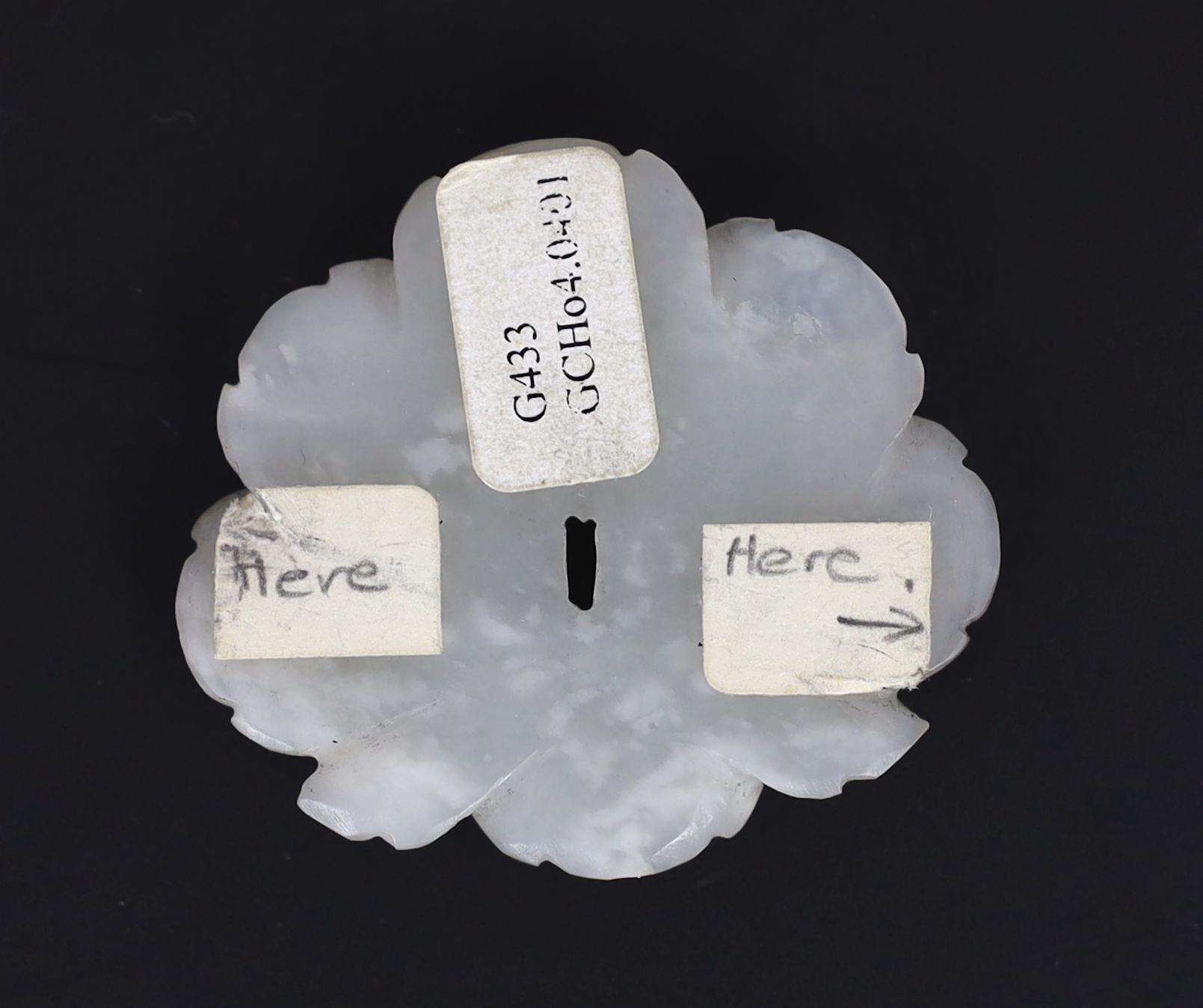 A Chinese small white jade flower head, Song/Yuan dynasty, 12th/13th century